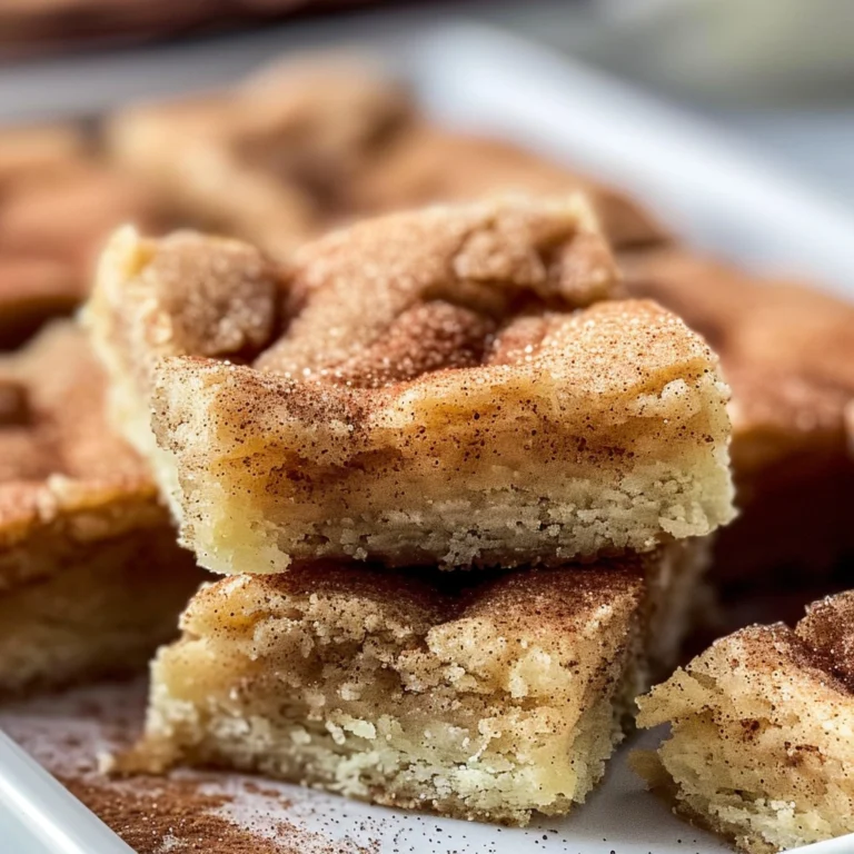 Chewy snickerdoodle cookie bars in a pan with cinnamon sugar topping